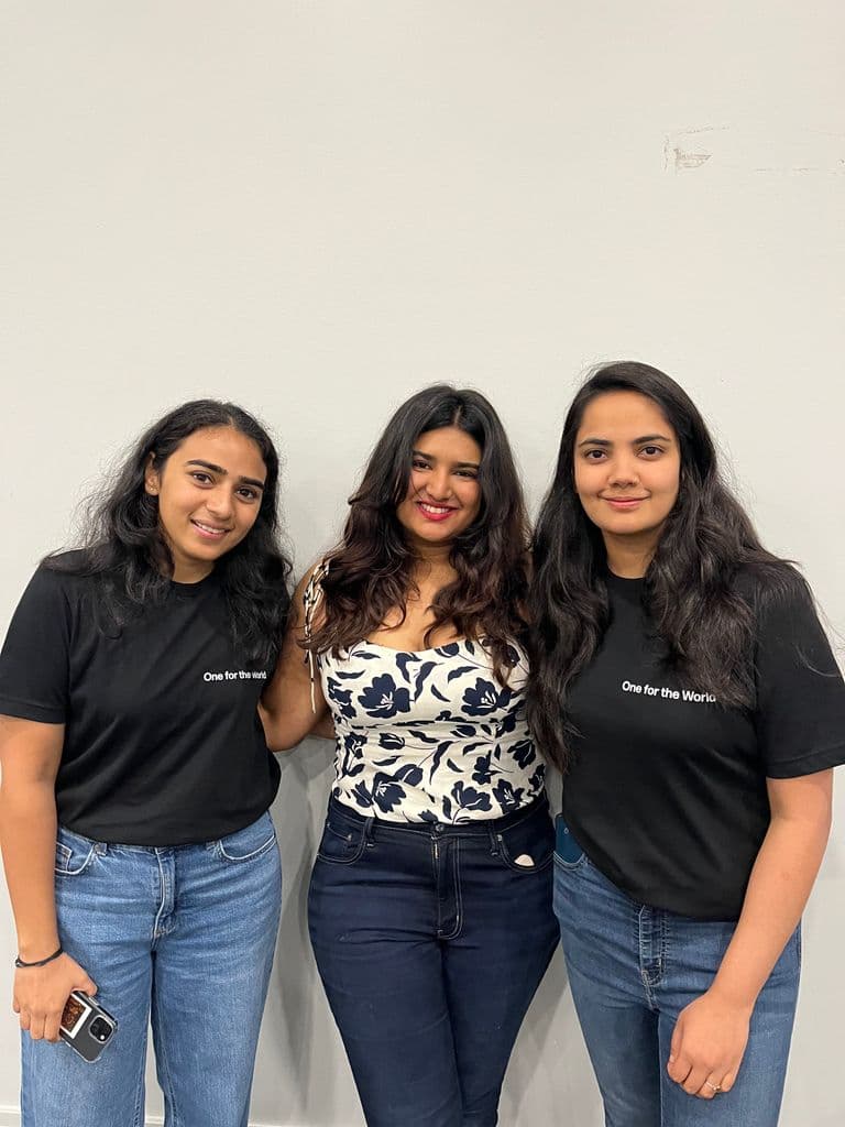 three women standing next to each other